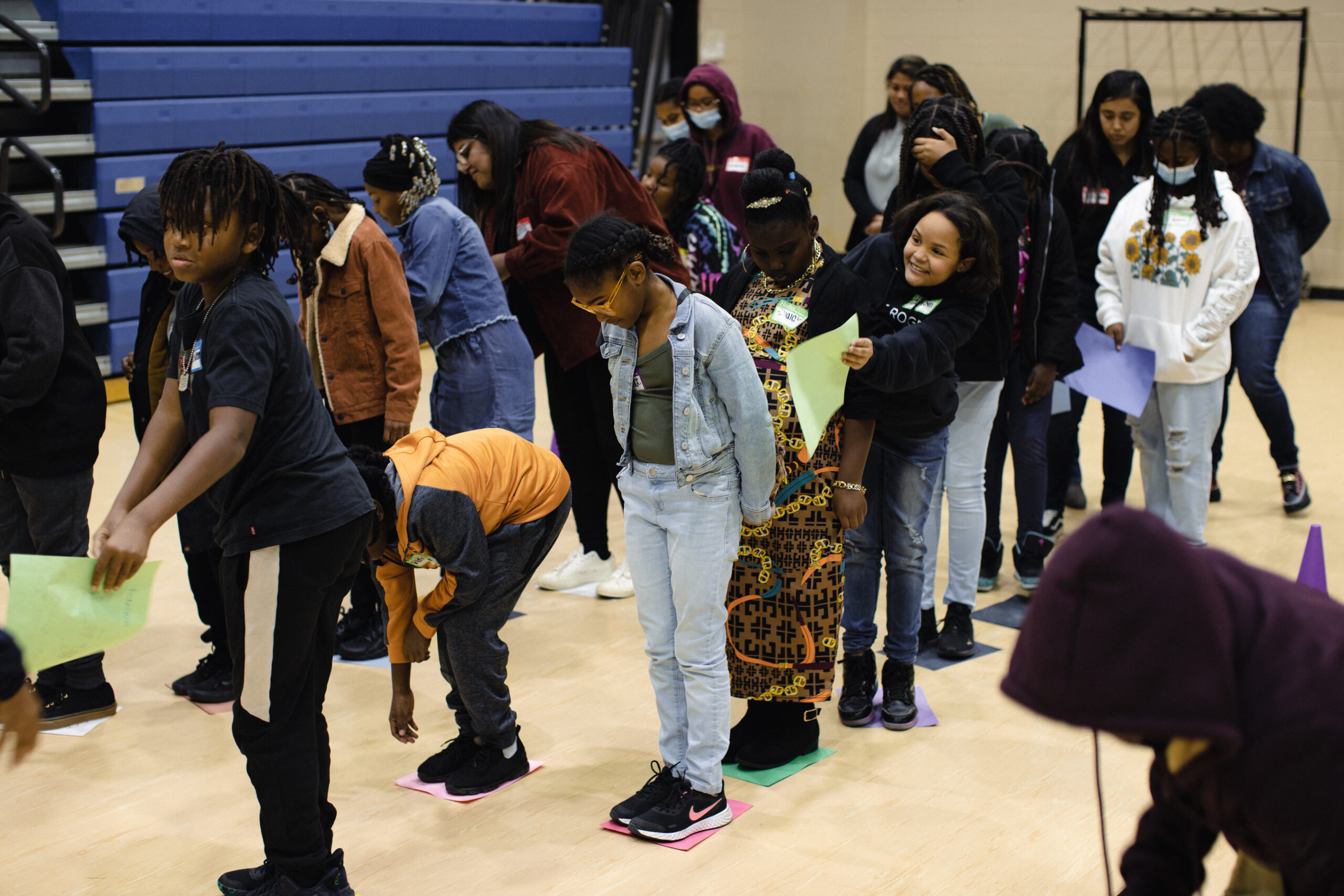 Students taking part in a group activity in a school gym