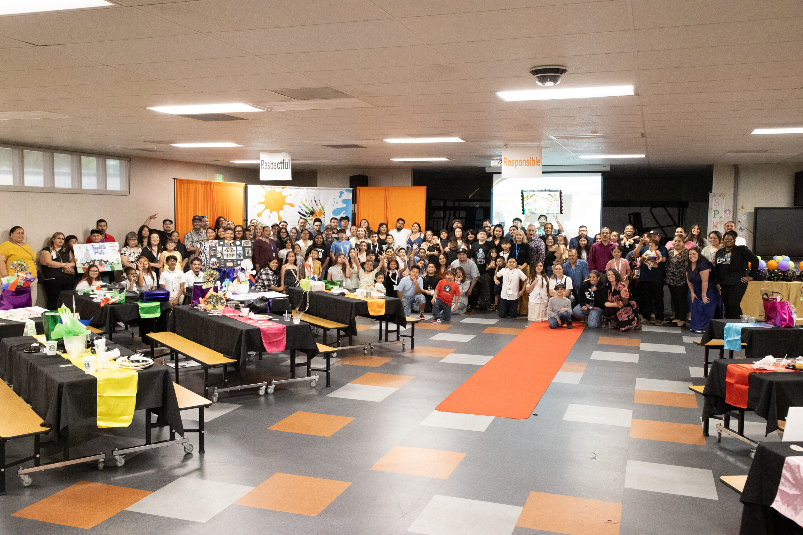 Students, families, and staff gathered at a Let’s Rise Above awards celebration